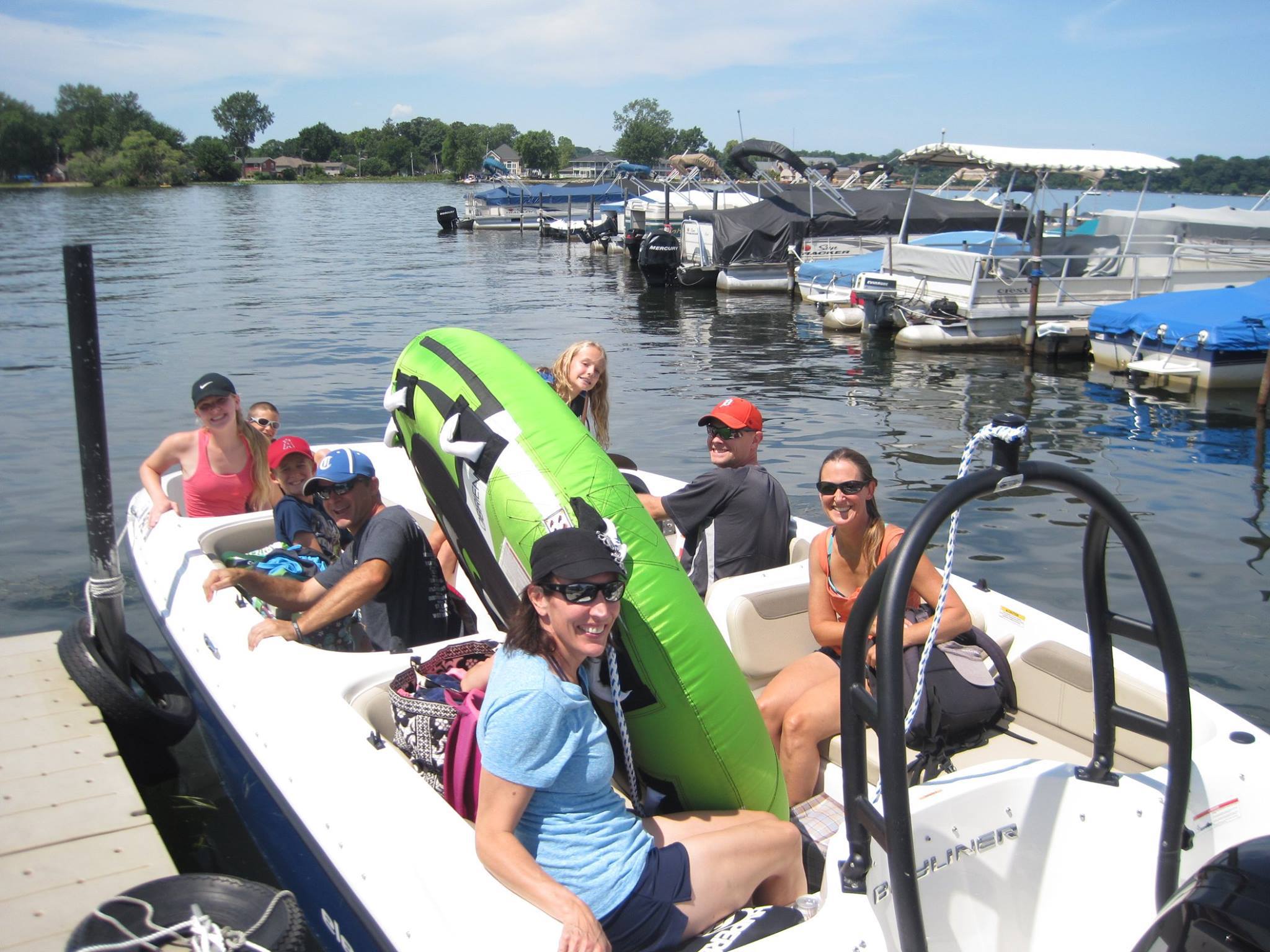 Family taking out ski boat with tube