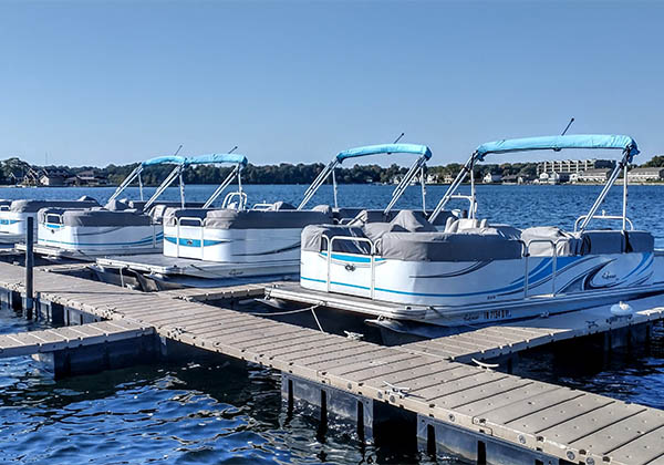 Pontoon boats docked at Pine Lake Marina