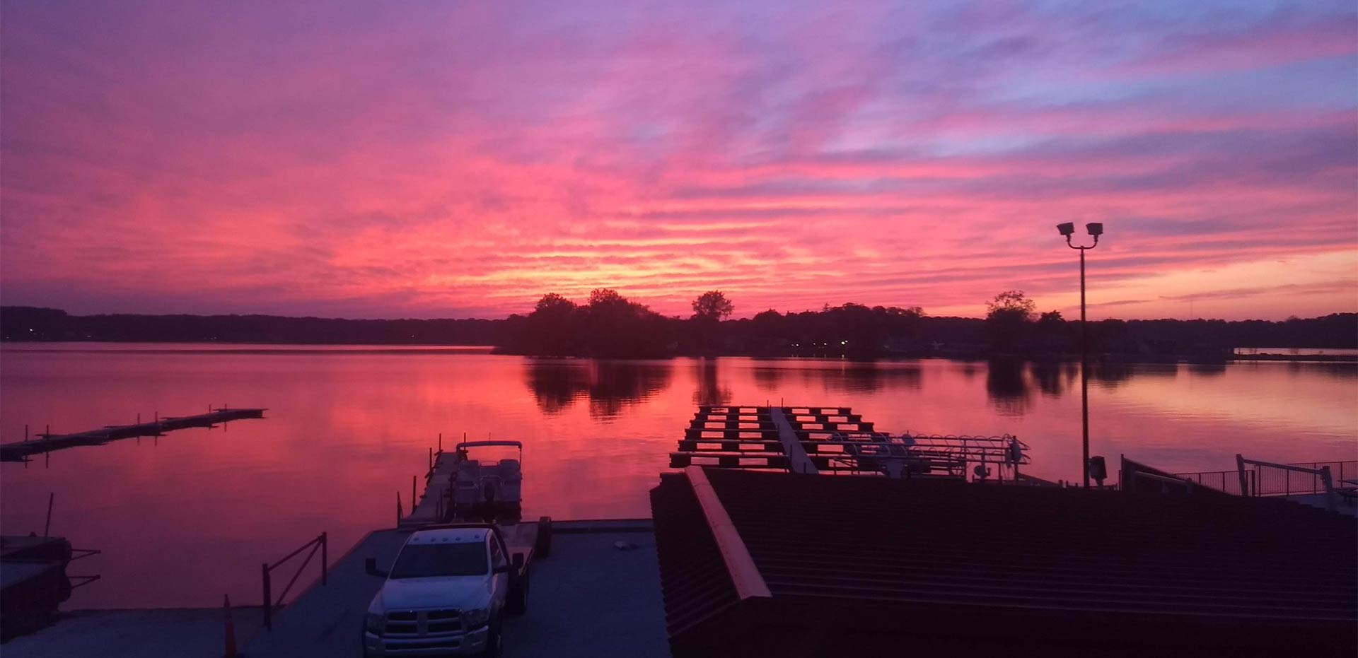 An orange sunset over Pine Lake