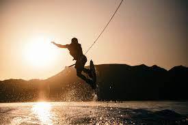 Wakeboarding behind boat